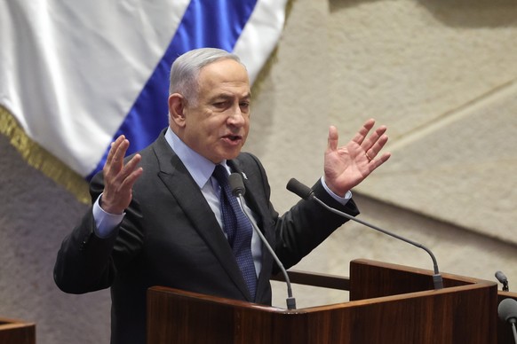epa11166726 Israeli Prime Minister Benjamin Netanyahu speaks during the voting session for the impeachment of Hadash-Ta?al party MP Ofer Cassif in Jerusalem, 19 February 2024. The motion was brought u ...