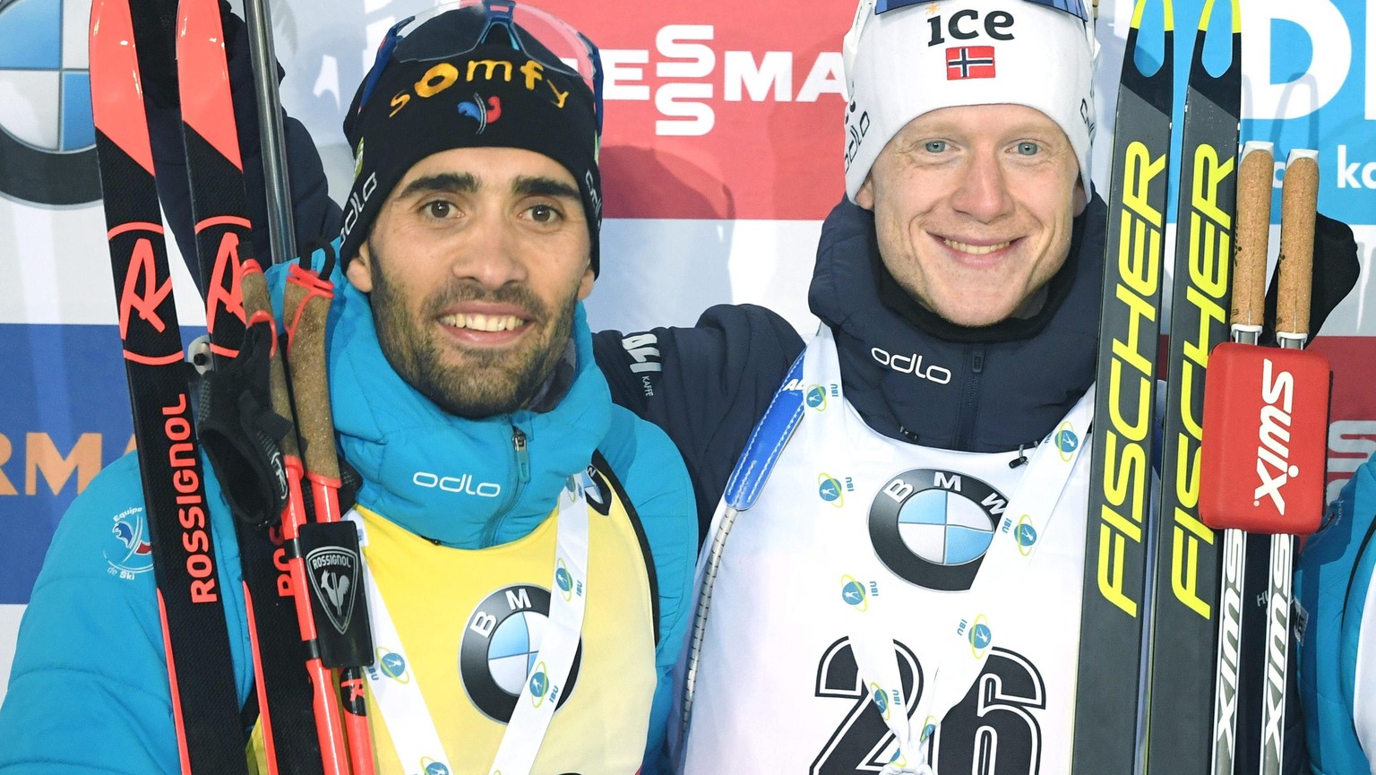 Top placed winners gather, with from left, second-placed Martin Fourcade of France, winner Johannes Thingnes Boe of Norway and third-placed Emilien Jacquelin of France, celebrate on the podium after t ...