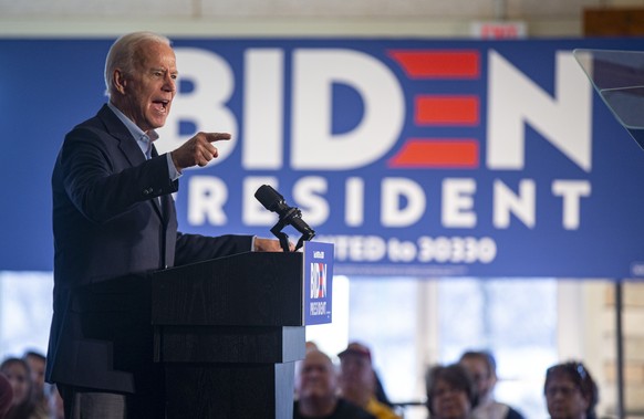 Democratic presidential candidate former Vice President Joe Biden speaks to local residents during a bus tour stop, Friday, Dec. 6, 2019, in Cedar Rapids, Iowa. (Andy Abeyta/The Gazette via AP)