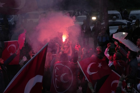 Supporters of President Recep Tayyip Erdogan cheer outside the headquarters of AK Party in Istanbul, Turkey, Sunday, May 14, 2023. More than 64 million people, including 3.4 million overseas voters, w ...