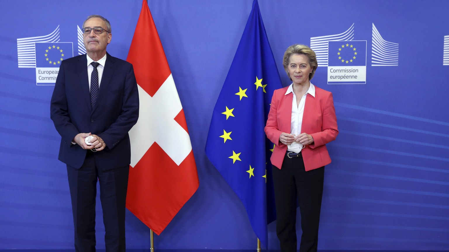 European Commission President Ursula Von der Leyen, right, greets Swiss President Guy Parmelin prior to a meeting at EU headquarters in Brussels, Friday, April 23, 2021. (Francois Walschaerts, Pool vi ...
