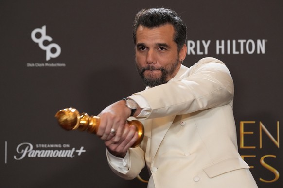 Wagner Moura poses in the press room with the award for best performance by a male actor in a motion picture  drama for "The Secret Agent" during the 83rd Golden Globes on Sunday, Jan. 11,  ...