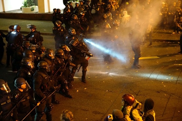 A police officer sprays the crowd with an irritant during a protest against the election of Republican Donald Trump as President of the United States in Portland, Oregon, U.S. November 12, 2016. REUTE ...