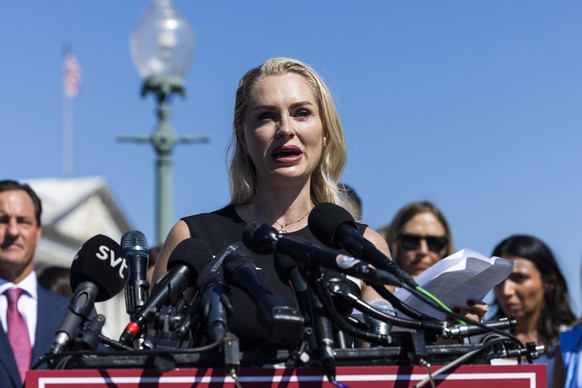 epa12349591 Survivor of the Jeffrey Epstein and Ghislaine Maxwell sex-trafficking scandal Anouska De Georgiou speaks at a press conference with other survivors outside the US Capitol in Washington, DC ...