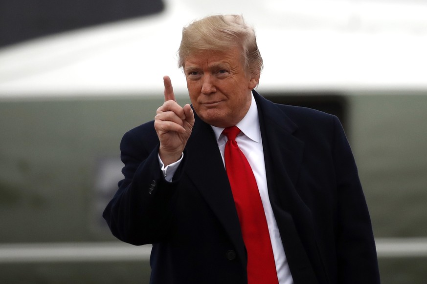 President Donald Trump gestures as he walks to Air Force One as he departs Monday, Nov. 26, 2018, at Andrews Air Force Base, Md. Trump is en route to Mississippi to campaign for Sen. Cindy Hyde-Smith, ...