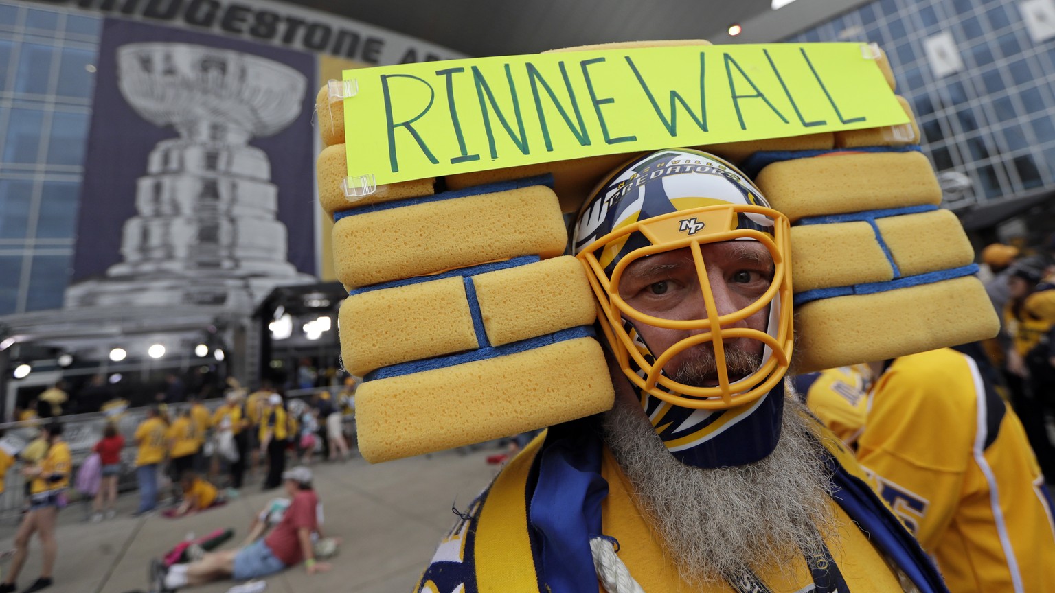 Nashville Predators fan Douglas Berg, of Franklin, Tenn., shows his support for goalie Pekka Rinne, of Finland, before Game 4 of the NHL hockey Stanley Cup Finals between the Nashville Predators and t ...