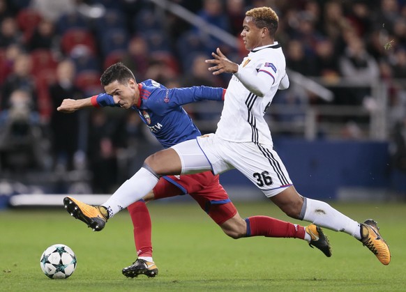 CSKA&#039;s Georgi Milanov, left, challenges for the ball with Basel&#039;s Manuel Akanji during the Champions League Group A soccer match between CSKA Moscow and Basel in Moscow, Russia, Wednesday, O ...
