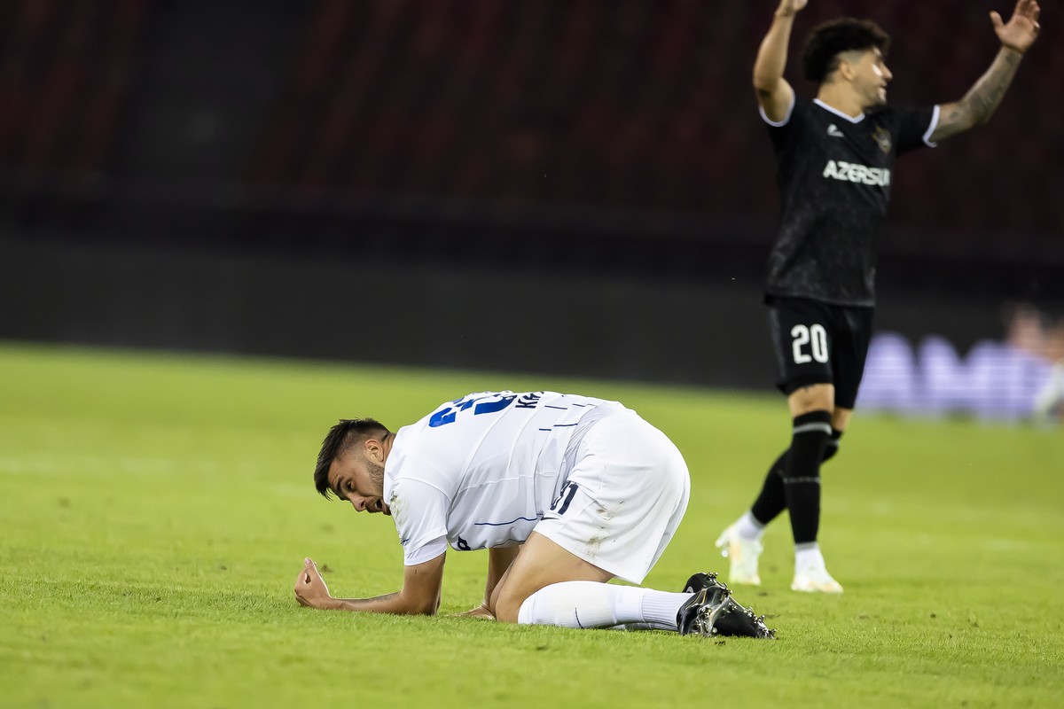 epa10094497 FC Zurich's Mirlind Kryeziu, left, reacts next to Qarabag FK's Kady, right, after the UEFA Champions League qualifying second round, second leg soccer match between Switzerland&# ...