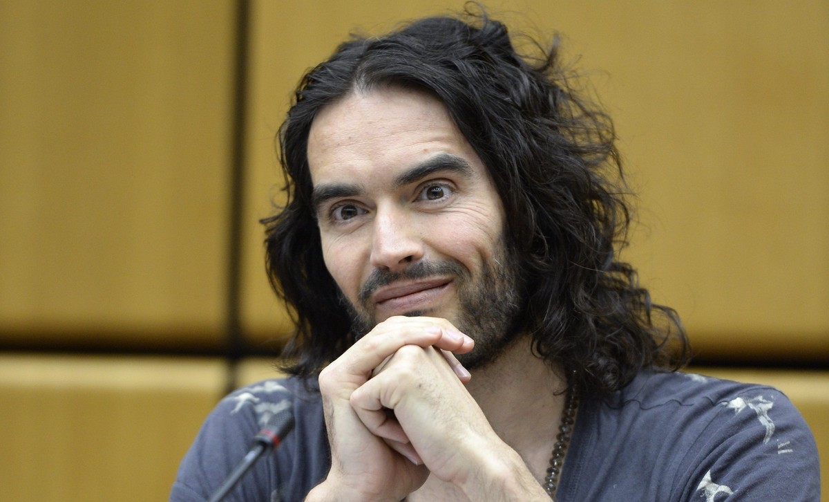 epa04132406 British actor and comedian Russell Brand reacts during a press conference at the United Nations Office on Drugs and Crime (UNODC) at the UN headquarters in Vienna, Austria, 19 March 2014.  ...