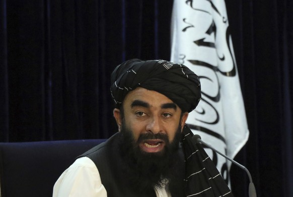 Taliban spokesman Zabihullah Mujahid speaks during a press conference in Kabul, Afghanistan Tuesday, Sept. 7, 2021. The Taliban on Tuesday announced a caretaker Cabinet stacked with veterans of their  ...