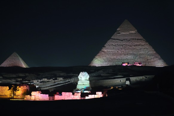 epa07251877 (FILE) - The Sphnix is lit up in front of the Great Pyramids during the Sound and Light show at the Giza Pyramids plateau, in Giza, Egypt, 29 October 2018 (Reissued 28 December 2018). Acco ...