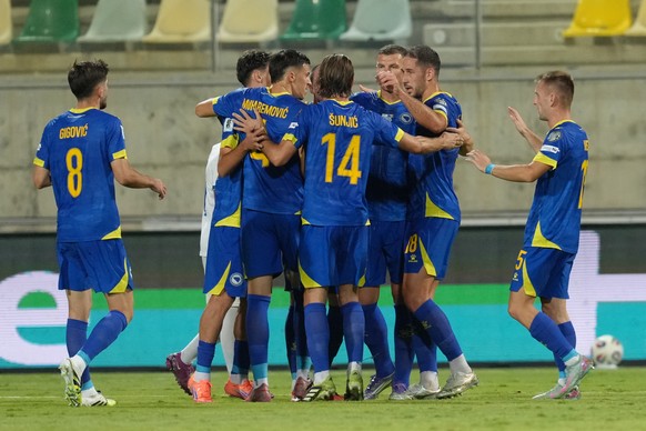 Bosnia-Herzegovina players celebrate after a goal during a World Cup 2026 group H qualifying soccer match between Cyprus and Bosnia-Herzegovina at AEK Arena in Larnaca, Cyprus, on Thursday, Oct. 9, 20 ...