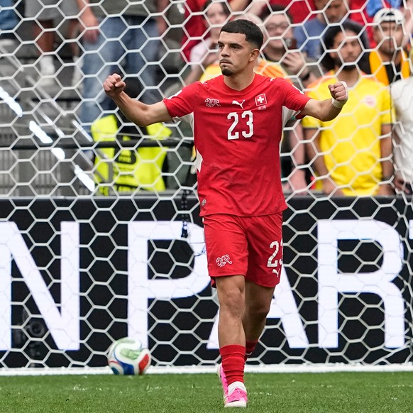 Switzerland's Zeki Amdouni reacts after scoring a goal during a penalty shootout in the World Cup round of 16 soccer match between Switzerland and Colombia in Vancouver, British Columbia, Tuesday ...