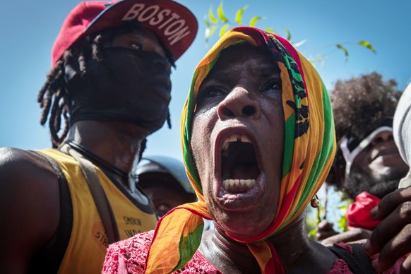 epa10789766 Citizens participate during a demonstration to demand security against gangs in Port-au-Prince, Haiti, 07 August 2023. Hundreds of Haitians took to the streets of Port-au-Prince to protest ...