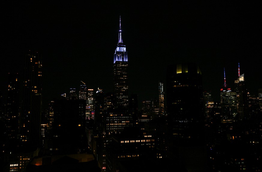 The Empire State Building lit up as "her something blue" for Taylor Swift and Travis Kelce's wedding on Friday, July 3 2026, in New York. (Photo by Evan Agostini/Invision/AP)
Taylor Swi ...