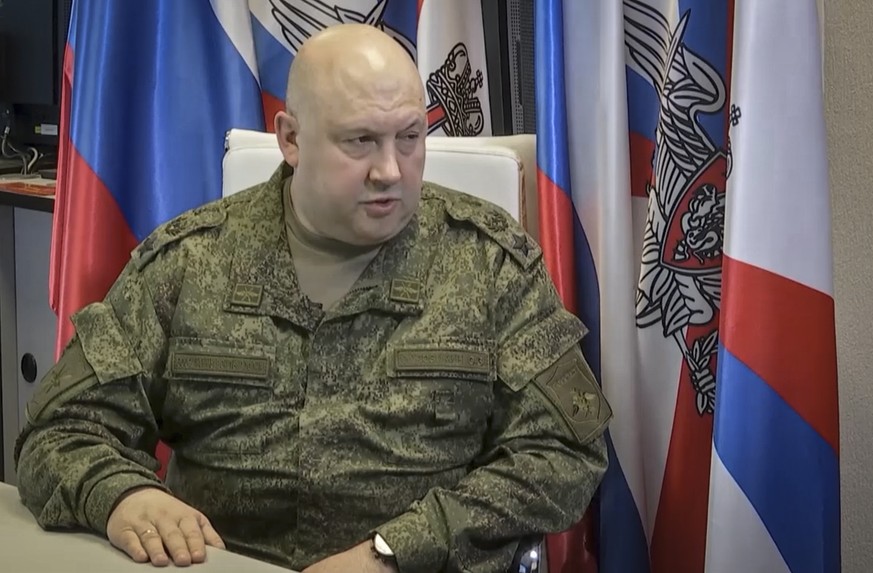 epa10251483 A still image taken from a handout video provided by the Russian Defence ministry press-service shows the Russian Joint Group of Forces Commander Surovikin speaking with journalists in Mos ...