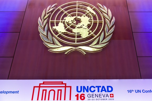 epa12466792 The UN logo and the UNCTAD logo are pictured during the UNCTAD 16 intergovernmental meeting, convened by the United Nations Conference on Trade and Development, at the European headquarter ...