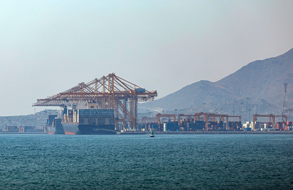 epa13095211 A container ship docks at Khor Fakkan Port, in Khor Fakkan, United Arab Emirates, 07 July 2026. As one of the upcoming measures for the UAE to avoid sending its shipping vessels through th ...