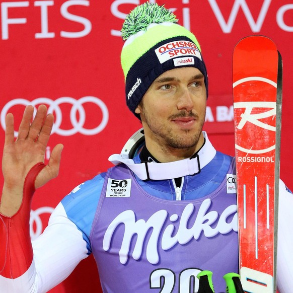 epa05682663 Carlo Janka of Switzerland celebrates his second place on the podium after the Men&#039;s Parallel Giant Slalom race at the FIS Alpine Skiing World Cup event in Alta Badia, Italy, 19 Decem ...