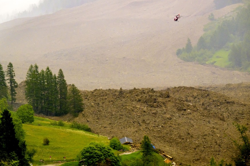 A large avalanche with a mixture of ice, rock, snow and water reach the valley floor is pictured in Wiler after the Birch glacier collapsing above Blatten, Switzerland, Wednesday, May 28, 2025. (KEYST ...