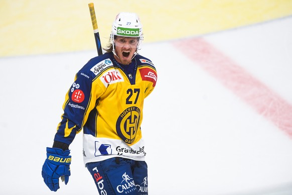 Davos&#039; player Magnus Nygren celebrates the 3-3 goal, during the match of National League Swiss Championship between HC Lugano and HC Davos at the ice stadium Corner Arena in Lugano, on Friday, Oc ...