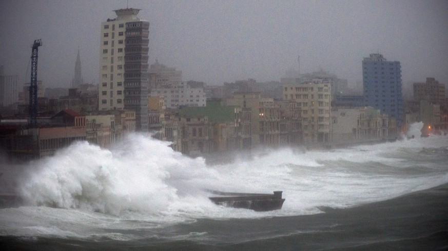 FILE - In this Sept. 9, 2017 file photo, strong waves brought by Hurricane Irma hit the Malecon seawall in Havana, Cuba. The elegant, seaside boulevard, where early 20th-century buildings are pounded  ...