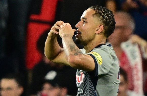 epa10165283 Noah Okafor of Salzburg celebrates after scoring the opening goal during the UEFA Champions League group E match between Red Bull Salzburg and AC Milan in Salzburg, Austria, 06 September 2 ...