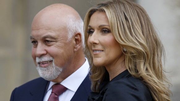 Canadian singer Celine Dion ( R) poses with husband Rene Angelil after she was awarded with France&#039;s Legion d&#039;Honneur by French President Nicolas Sarkozy during a ceremony at the Elysee Pala ...
