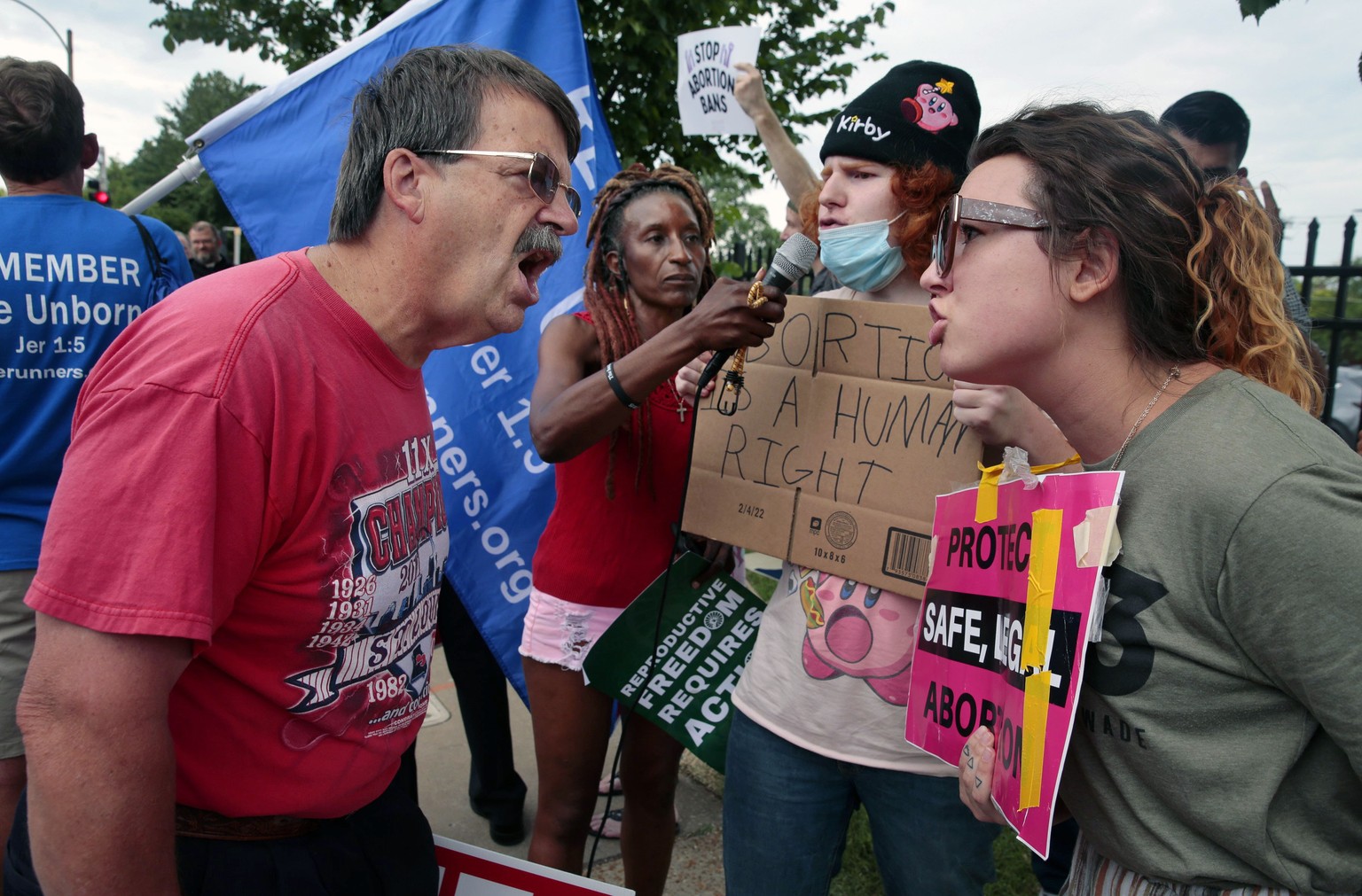 Steve Sallwasser of Arnold debates Brittany Nickens of Maplewood during competing rallies held outside Planned Parenthood of Missouri following the U.S. Supreme Court announcement overturning Roe v. W ...