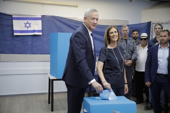 Blue and White party leader Benny Gantz and his wife Revital vote in Rosh Haayin, Israel, Tuesday, Sept. 17, 2019. Israelis began voting Tuesday in an unprecedented repeat election that will decide wh ...