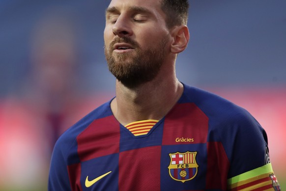 Barcelona&#039;s Lionel Messi reacts during the Champions League quarterfinal match between FC Barcelona and Bayern Munich at the Luz stadium in Lisbon, Portugal, Friday, Aug. 14, 2020. Gerard Piqué s ...