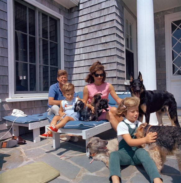 Trip to Hyannis Port u2013 Squaw Island, 1963-08-14. President John F. Kennedy, First Lady Jacqueline Kennedy, and their children, Caroline Kennedy and John F. Kennedy, Jr., play with their dogs, Shan ...