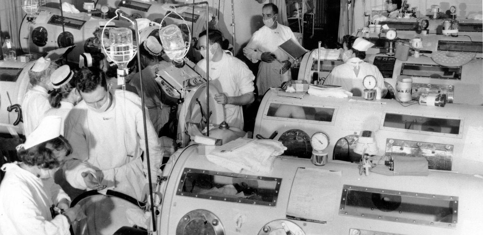 This is a scene in the emergency polio ward at Haynes Memorial Hospital in Boston, Ma. on Aug. 16, 1955, showing critical victims lined up in &quot;iron-lung&quot; respirators. Americans celebrated th ...