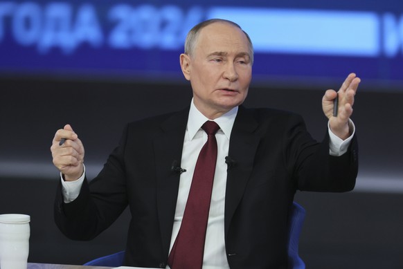 epa11785296 Russian President Vladimir Putin gestures as he answers questions during his annual live broadcast press conference with Russian federal, regional, and foreign media at the Gostiny Dvor fo ...