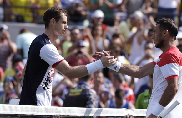 Andy Murray, of England, shakes hands with Juan Monaco, of Argentina, after their match at the 2016 Summer Olympics in Rio de Janeiro, Brazil, Tuesday, Aug. 9, 2016. Murray defeated Monaco 6-3, 5-1.(AP Photo/Charles Krupa)