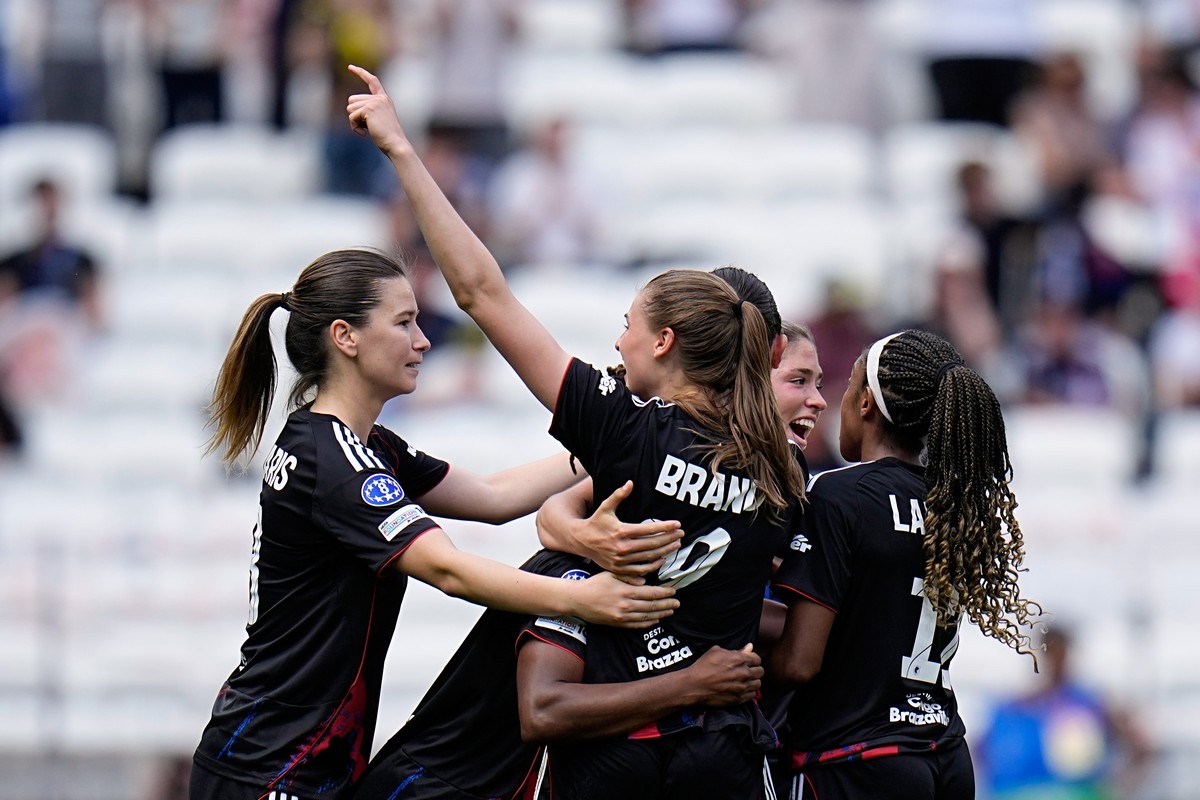 Lyonnes' Jule Brand celebrates after scoring her side's third goal during the Women's Champions League semifinal, second leg, soccer match between OL Lyonnes and Arsenal, in Decines, ou ...