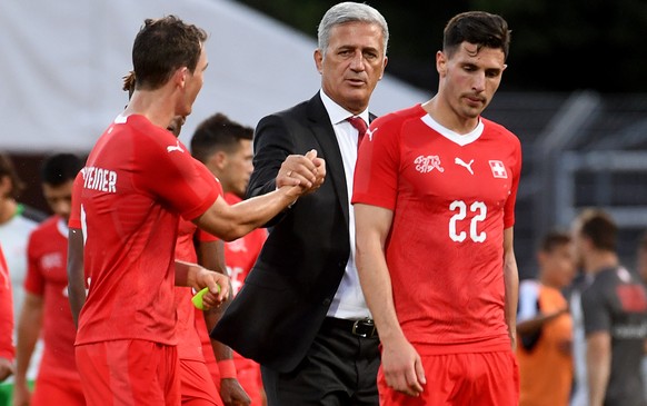 Switzerland&#039;s Head Coach Vladimir Petkovic, center, with Switzerland&#039;s Stephan Lichtsteiner, left, and Switzerland&#039;s Fabian Schaer, right, during an international friendly soccer match  ...