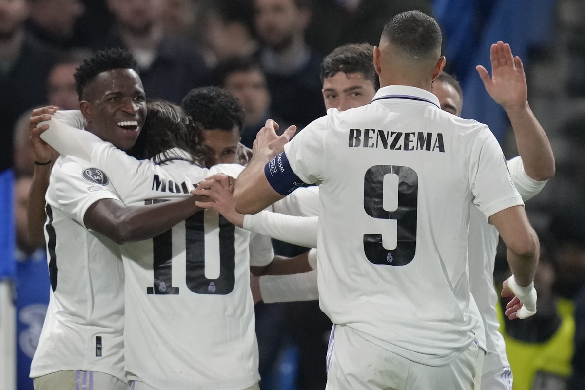Real Madrid's players celebrates after Rodrygo scored the opening goal during the Champions League quarterfinal second leg soccer match between Chelsea and Real Madrid at Stamford Bridge stadium  ...