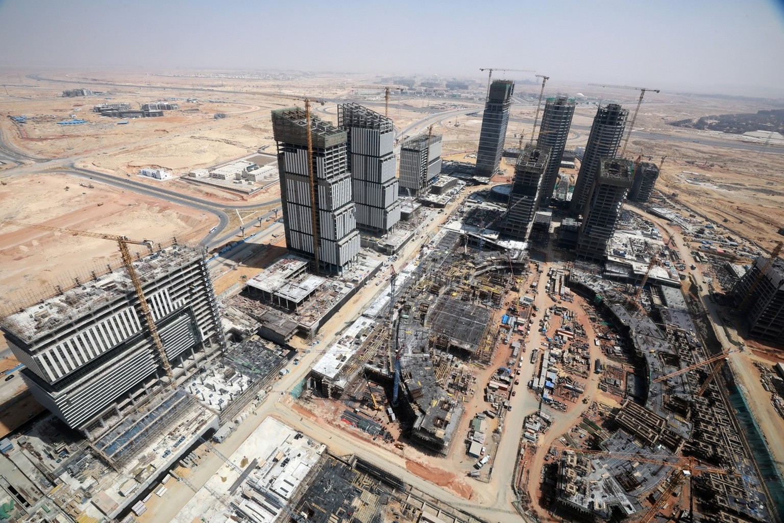 epa09078297 General view of the construction site of the central business district of the new administrative capital, 45 kilometers east of Cairo, Egypt, 16 March 2021. Egypt started the construction  ...