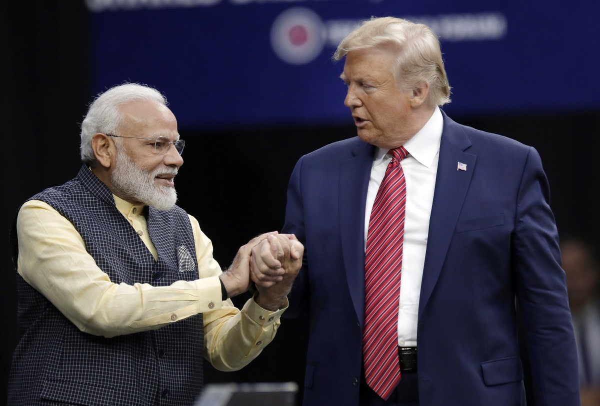 FILE - Prime Minister Narendra Modi and President Donald Trump, right, shake hands after introductions during the "Howdi Modi" event, Sept. 22, 2019, at NRG Stadium in Houston. (AP Photo/Mic ...