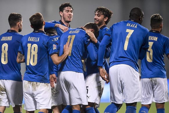 Italy&#039;s players celebrate after their teammate Domenico Berardi, center (11) scored the winning goal during the UEFA Nations League soccer match between Italy and Poland at Mapei Stadium, in Regg ...