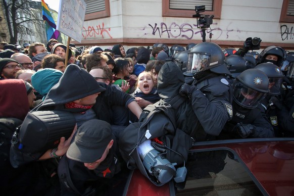 epa04667541 Protesters and police clash during a demonstration on the occasion of the opening of the new headquarters of the European Central Bank (ECB) in Frankfurt, Germany, 18 March 2015. German au ...