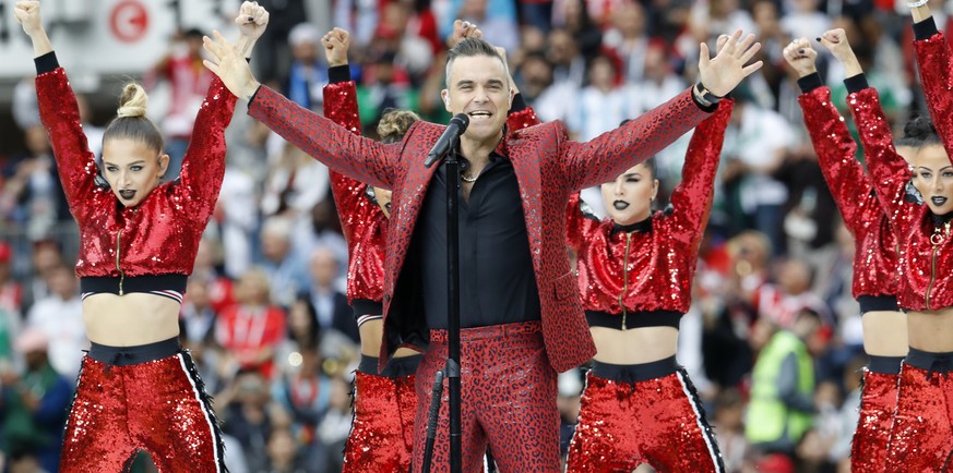 British singer Robbie Williams sings at the opening of the World Cup 2018 ahead of the start of the group A match between Russia and Saudi Arabia which opens the 2018 soccer World Cup at the Luzhniki  ...