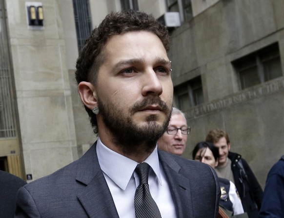 FILE - In this March 20, 2015 file photo, actor Shia LaBeouf is escorted by court officers as he leaves Manhattan Criminal court in New York. LaBeouf has received stitches to his head and hand after s ...