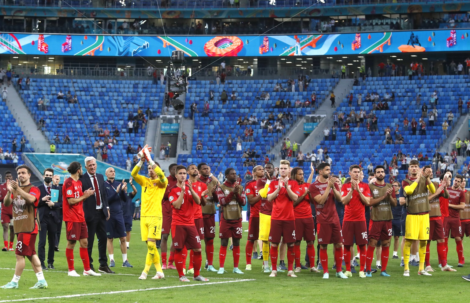Switzerland players applaud fans after the Euro 2020 soccer championship quarterfinal match between Switzerland and Spain, at the Saint Petersburg stadium in Saint Petersburg, Friday, July 2, 2021. (M ...