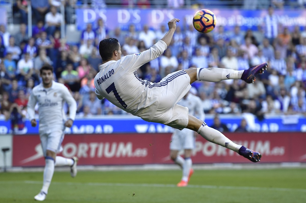 Real Madrid's Cristiano Ronaldo, makes a scissor kick during the Spanish La Liga soccer match between Real Madrid and Deportivo Alaves, at Mendizorroza stadium, in Vitoria, northern Spain, Saturd ...