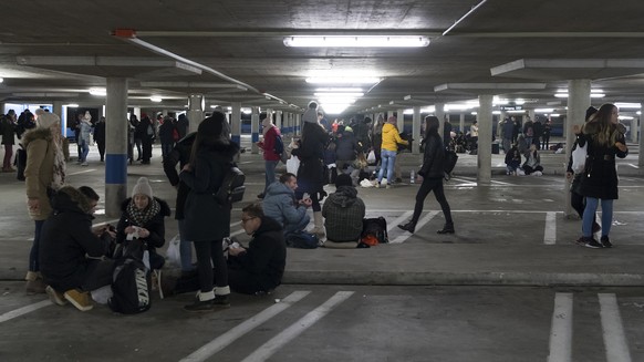 Visitors gather in the parking of the St. Jakob Arena prior to an evening prayer on the occasion of the fortieth annual international young adults meeting of the ecumenical Christian monastic order of ...