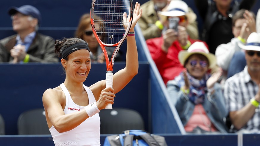 Switzerland&#039;s Victorija Golubic celebrates after winning her second round match against Evgeniya Rodina of Russia, at the WTA Ladies Championship tennis tournament in Gstaad, Switzerland, Friday, ...