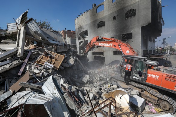 epa10922268 Palestinians search for victims and survivors in the rubble of Al-Naqeeb family house leveled in an Israeli airstrike in Al Nusairat, central Gaza Strip, 16 October 2023. Israel has warned ...