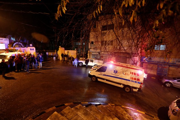 Ambulances are seen in front of the Italian hospital where some of the injured were evacuated to after an attack, in the city of Karak, Jordan, December 18, 2016.REUTERS/Muhammad Hamed